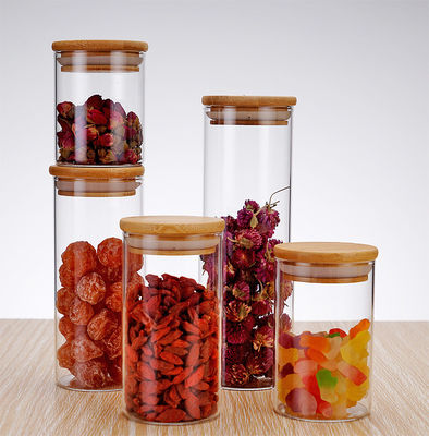 comprar ODM / OEM personalizado elegante casa de vidrio redondo Jar de almacenamiento de alimentos 8oz 26oz Jar de vidrio de almacenamiento de alimentos con tapa de bambú hermética diseño elegante y práctico online manufacture