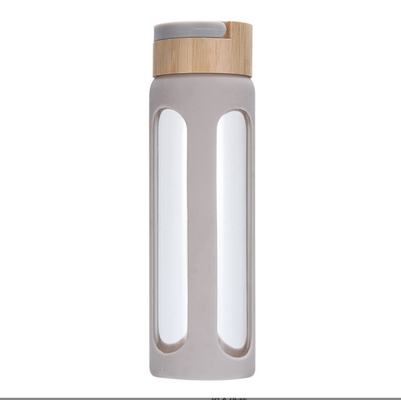 comprar Botella de agua de vidrio de alto borosilicato personalizada de 550/750 ml Botella de bebida de vidrio personalizada con manga de silicona y tapa de bambú fácil de limpiar y mantener online manufacture